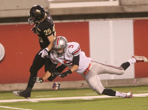 Paul Fraughton | Salt Lake Tribune
Spanish Fork's Cameron Money saves the touchdown by knocking Desert Hills' Bridger Cowdin out of bounds at the five yard line. Desert Hills High School played Spanish Fork at Rice Eccles Stadium in a State 3A semi-final game.
 Thursday, November 8, 2012