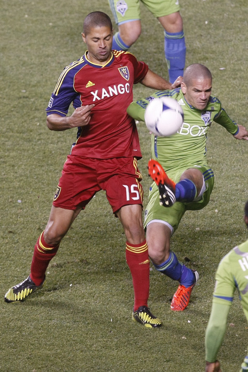 Chris Detrick  |  The Salt Lake Tribune
Real Salt Lake forward Alvaro Saboru (15) and Seattle Sounders FC midfielder Osvaldo Alonso (6) go for the ball during the first half of the Major League Soccer playoff game at Rio Tinto Stadium Thursday November 8, 2012. The score is 0-0 at halftime.
