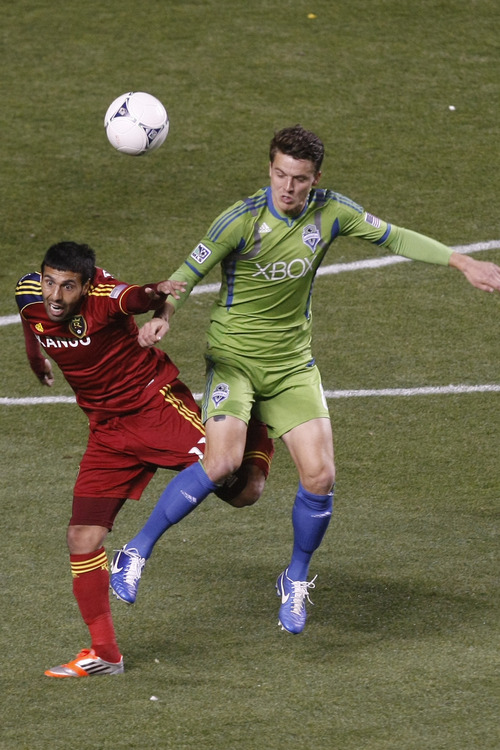 Chris Detrick  |  The Salt Lake Tribune
Real Salt Lake midfielder Javier Morales (11) and Seattle Sounders FC defender Marc Burch (8) go for the ball during the first half of the Major League Soccer playoff game at Rio Tinto Stadium Thursday November 8, 2012. The score is 0-0 at halftime.