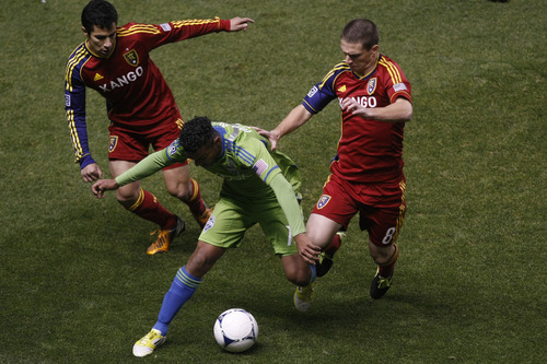 Chris Detrick  |  The Salt Lake Tribune
Real Salt Lake defender Tony Beltran (2) and Real Salt Lake midfielder Will Johnson (8) and Seattle Sounders FC midfielder Mario Martinez (15) during the first half of the Major League Soccer playoff game at Rio Tinto Stadium Thursday November 8, 2012. The score is 0-0 at halftime.