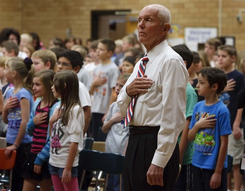 Leah Hogsten  |  The Salt Lake Tribune
Prisoner of War Veteran Col. Jay Hess of Farmington, Utah recites the pledge of allegiance with students at Knowlton Elementary, a school named after George Knowlton who was Hess' principal when he was a student. Hess shares his experiences with Knowlton Elementary students as part of the several Veterans Day events throughout Davis School District, Wednesday, November 7, 2012. Hess was a 37-year-old captain in the Air Force in 1967 when his F-105 was shot down. He bailed out and was captured by the North Vietnamese. Hess spent 5 1/2 years as a prisoner of war at Hoa Lo Prison, which the captives facetiously nicknamed the Hanoi Hilton.
