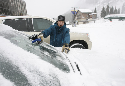 Scott Sommerdorf  |  The Salt Lake Tribune              
Scott Mathers, manager of the ski school at Alta, cleans off his windshield before leaving the resort Friday afternoon, Nov. 8, 2012.