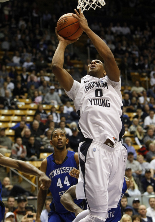 Chris Detrick  |  The Salt Lake Tribune
Brigham Young Cougars forward Brandon Davies (0) shoots past Tennessee State Tigers forward Michael Green (44) during the second half of the game at the  Marriott Center Friday November 9, 2012.  BYU won the game 81-66.