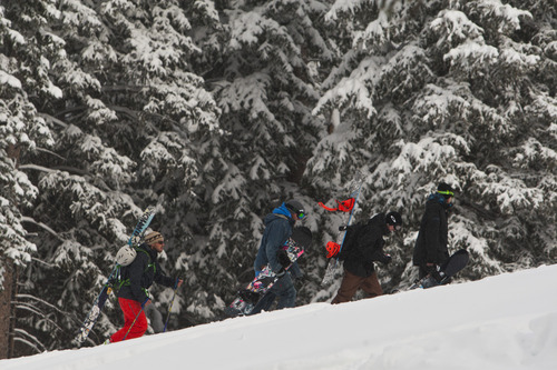 Chris Detrick  |  The Salt Lake Tribune
Skiers and snowboarders hike up the slope at Brighton Saturday November 10, 2012.