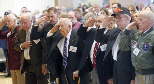 Al Hartmann  |  The Salt Lake Tribune
Some of the 11 American service veterans salute the flag during a Veterans Day ceremony at the University of Utah Friday, November 9. These 11 veterans from a variety of wars were chosen for their exemplary service and awarded honorary medals.