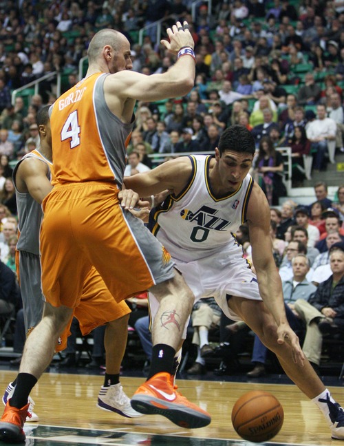 Kim Raff  |  The Salt Lake Tribune
Utah Jazz center Enes Kanter (0) drives the basket past (left) Phoenix Suns center Marcin Gortat (4) during the first half at EnergySolutions Arena in Salt Lake City, Utah on November 10, 2012.