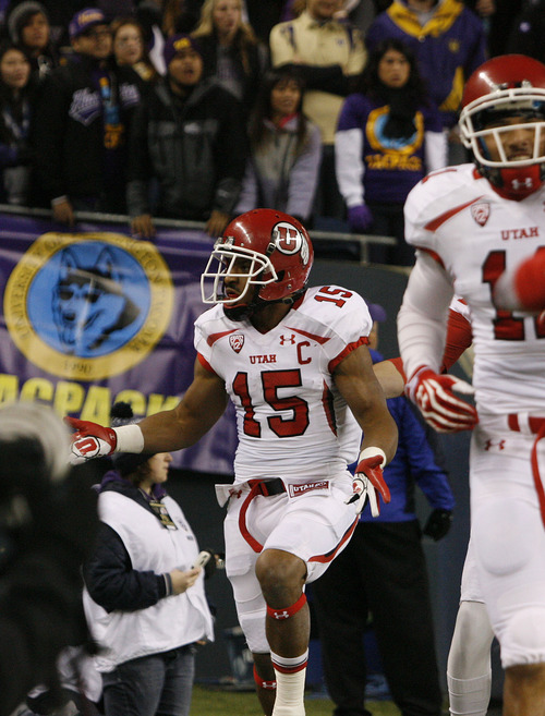 Scott Sommerdorf  |  The Salt Lake Tribune              
Utah RB John White looks at the Huskie fans and celebrates his 46 yard TD run to give the Utes an early 8-0 lead. Utah trailed Washington 14-8 at the half at Century Link Field in Seattle, Saturday, November 10, 2012.