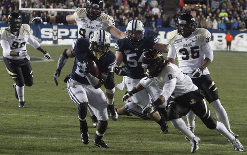 Rick Egan  | The Salt Lake Tribune 

Brigham Young Cougars running back Jamaal Williams (21) runs for a touchdown, in football action, BYU vs. Idaho Vandals, at Lavell Edwards Stadium, Saturday, November 10, 2012