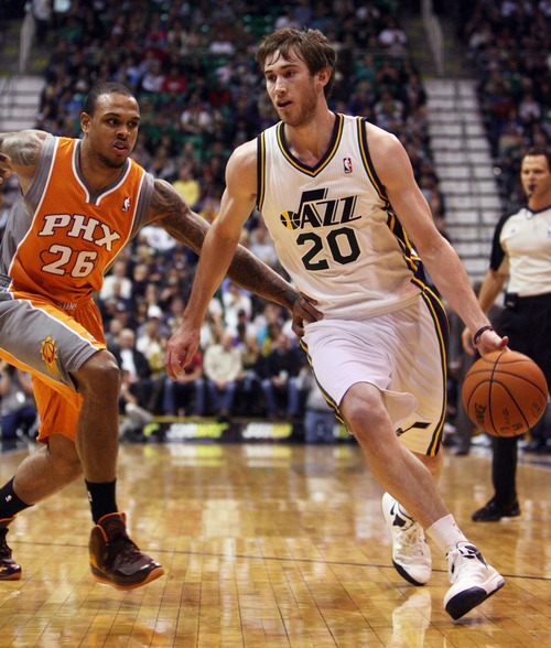 Kim Raff  |  The Salt Lake Tribune
Utah Jazz shooting guard Gordon Hayward (20) drives the basket past Phoenix Suns point guard Shannon Brown (26) during the second half at EnergySolutions Arena in Salt Lake City, Utah on November 10, 2012. The Jazz went on to win the game 94-81.