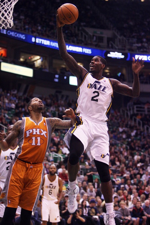 Kim Raff  |  The Salt Lake Tribune
(right) Utah Jazz power forward Marvin Williams (2) attempts a layup as Phoenix Suns power forward Markieff Morris (11) defends at EnergySolutions Arena in Salt Lake City, Utah on November 10, 2012. The Jazz went on to win the game 94-81.