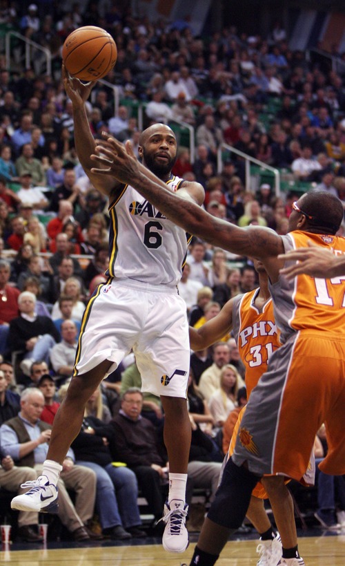 Kim Raff  |  The Salt Lake Tribune
Utah Jazz point guard Jamaal Tinsley (6) passes the ball past Phoenix Suns shooting guard P.J. Tucker (17) during the second half at EnergySolutions Arena in Salt Lake City, Utah on November 10, 2012. The Jazz went on to win the game 94-81.