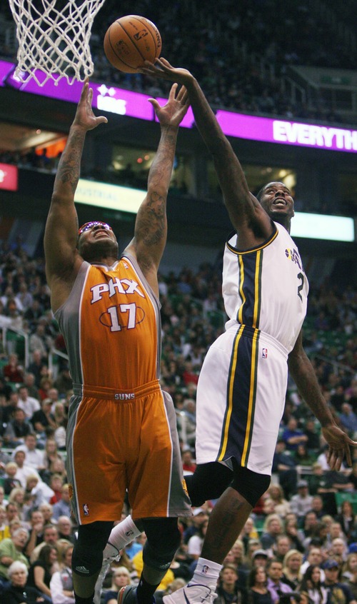 Kim Raff  |  The Salt Lake Tribune
Utah Jazz power forward Marvin Williams (2) competes with (left) Phoenix Suns shooting guard P.J. Tucker (17) for a rebound during the second half at EnergySolutions Arena in Salt Lake City, Utah on November 10, 2012. The Jazz went on to win the game 94-81.