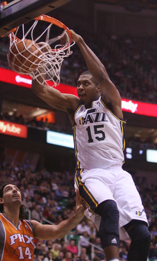 Kim Raff  |  The Salt Lake Tribune
Utah Jazz power forward Derrick Favors (15) dunks the ball during the second half against the Phoenix Suns at EnergySolutions Arena in Salt Lake City, Utah on November 10, 2012. The Jazz went on to win the game 94-81.