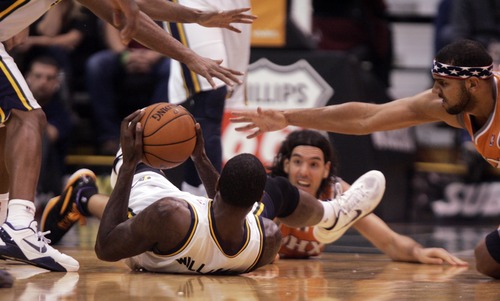 Kim Raff  |  The Salt Lake Tribune
Utah Jazz power forward Marvin Williams (2) keeps control of a ball on the floor as he feel pressure from Phoenix Suns players at EnergySolutions Arena in Salt Lake City, Utah on November 10, 2012. The Jazz went on to win the game 94-81.