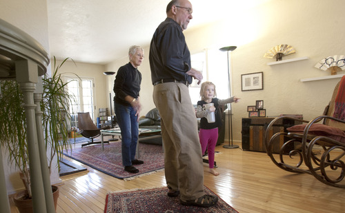 Steve Griffin |  The Salt Lake Tribune
Beverly and Bill Miller help their granddaughter, Penny, water the plants in their Salt Lake City home Thursday, November 8, 2012. Beverly was diagnosed with Alzheimer's when she was 64. Bill retired early to become her full-time caregiver. While she is still verbally and socially engaged, she has trouble with linear sequencing. She can no longer drive and cannot remember where she is in a recipe, or how to dial on a phone or use the computer. Bill says her condition will worsen as time goes on.