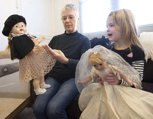 Steve Griffin |  The Salt Lake Tribune
Beverly Miller and her granddaughter, Penny, play with Beverly's childhood dolls in their Salt Lake City home Thursday November 8, 2012. Beverly was diagnosed with Alzheimer's when she was 64. Her husband, Bill, retired early to become her full-time caregiver. While she is still verbally and socially engaged, she has trouble with linear sequencing. She can no longer drive and cannot remember where she is in a recipe, or how to dial on a phone or use the computer. Bill says her condition will worsen as time goes on.