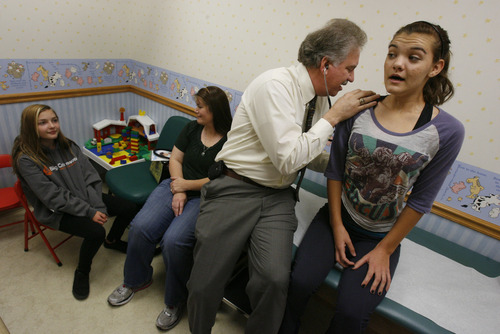 Francisco Kjolseth  |  The Salt Lake Tribune
Keith Ramsey, an osteopathic pediatrician in South Jordan checks Kaylee Franklin, 16, of West Valley as her sister Jacquie Robb, 12, left, and her mom Michelle Robb sit in on Monday, November 5, 2012. Osteopathic schools of medicine are eyeing Utah as ripe for competing alternatives to the U.'s medical school. But are osteopathic doctors the same as traditional MD's? Yes, says Keith Ramsey, an osteopathic pediatrician in South Jordan. Osteopaths have the same level of training and can write prescriptions and do surgery. The only difference is they're also trained in a form of manipulation similar to what chiropractors use. But Ramsey, who works with children, rarely uses manipulation.