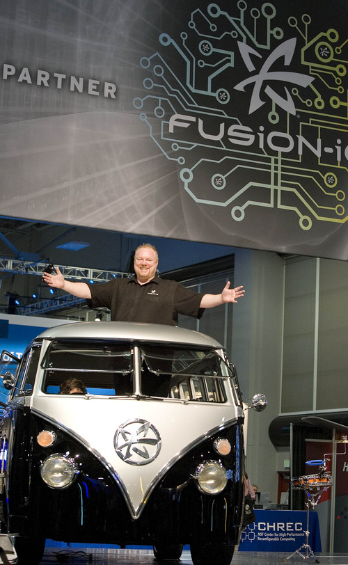 Paul Fraughton  | The Salt Lake Tribune
Rick White of Fusion-io stands in the company's 1962 VW minibus Safari Edition with the company logo on the front panel. The van is part of Fusion-io's elaborate booth at SC12, a  supercomputing convention at the Salt Palace Convention Center.
 Tuesday, November 13, 2012