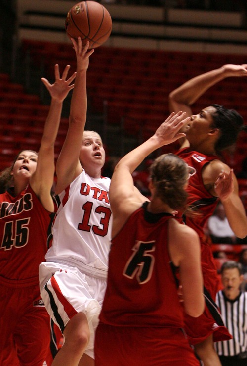 Leah Hogsten  |  The Salt Lake Tribune
Utah's Rachel Messer is fouled by Southern Utah's Lori Parkinson. University of Utah Lady Utes defeated Southern Utah 79-61 Tuesday, November 13, 2012 in their home opener.