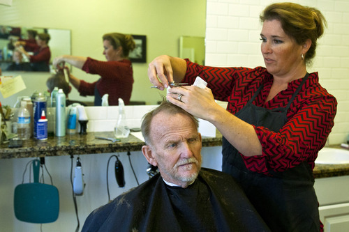 Chris Detrick  |  The Salt Lake Tribune
Owner Leah Bryson cuts Rodney Eggett's hair at Lee's Barber Shop in Bountiful.