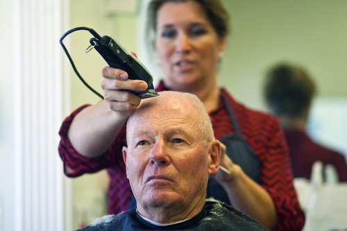 Chris Detrick  |  The Salt Lake Tribune
Owner Leah Bryson cuts Val Stock's hair at Lee's Barber Shop in Bountiful on  Nov. 7, 2012. Stock has been coming to the barber shop since 1964.