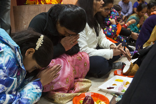 Chris Detrick  |  The Salt Lake Tribune
Sujatha Prakash and her daughter Shree, 11, participate in personal worship during the festival of Diwali at the Sri Ganesha Hindu Temple Tuesday November 13, 2012.