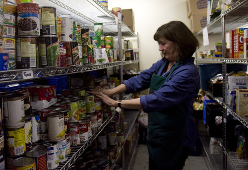 Kim Raff  |  The Salt Lake Tribune
Lynne Giuffre sorts shelves at Hildegard's Food Pantry in Salt Lake City on Wednesday, Nov. 14, 2012. Mayor Ralph Becker and Salt Lake City's Food Policy Task Force release the Draft Community Food Assessment at the food pantry during a press conference.