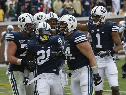 Rick Egan  | The Salt Lake Tribune 

The BYU offense celebrates with Cougar running back Jamaal Williams (21) after he scored a touchdown against Georgia Tech, at Bobby Dodd Stadium in Atlanta, Saturday, Oct. 27, 2012