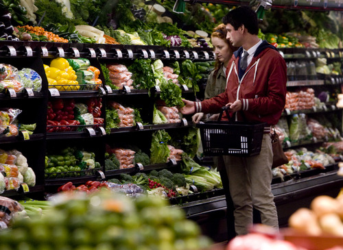 Kim Raff  |  The Salt Lake Tribune
Matthew Allred and Kylee Gubler pick out produce while shopping at Smith's Food and Drug in Salt Lake City on Wednesday, Nov. 14, 2012.