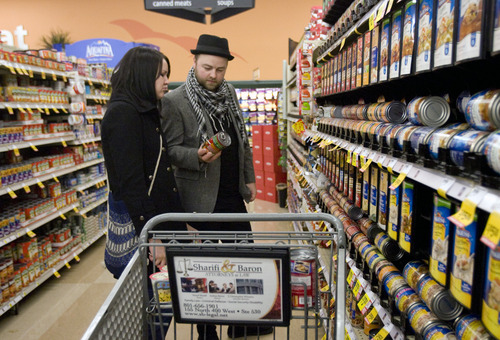 Kim Raff  |  The Salt Lake Tribune
Heather Bailey and Aaron Martell pick out cans of soup to buy while shopping at Smith's Food and Drug in Salt Lake City on Wednesday, Nov. 14, 2012.