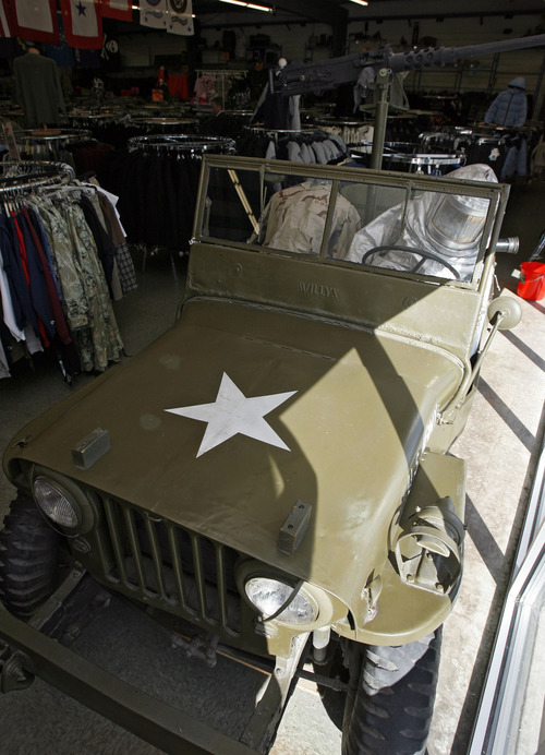 Francisco Kjolseth  |  The Salt Lake Tribune
The old Army Surplus Store at 4974 S. Redwood Road is slowly moving into a different era as surplus is more difficult to find. Military props abound, however, with a Sergeant missile in the front parking lot, old jeep and artillery horse-drawn wagon as well as planes and bombs hanging from the rafters.