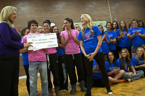 Chris Detrick  |  The Salt Lake Tribune
Lexi Yraguen and other members of the Bingham High School Minerettes, present a $500 check to Laura Hadley, executive director of the Cystic Fibrosis Foundation Wednesday October 24, 2012. The check was donated in memory of their former teammate, Astra Waller, who died from it last year.