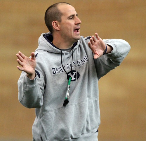 Rick Egan  | The Salt Lake Tribune 

BYU offensive coordinator Brandon Doman gives directions during spring practice, Monday, March 26, 2012.