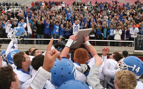 Leah Hogsten  |  The Salt Lake Tribune
Dixie High School celebrates the state championship. Dixie High School defeated Spanish Fork High School 49-21 to win the 3A State Championship Football game at Rice Eccles Stadium Friday, November 16, 2012. The win was Dixie's first 3A state football championship since 1998.