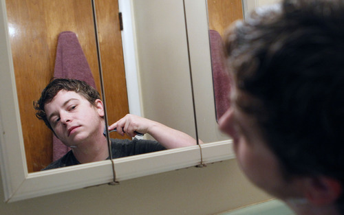 Al Hartmann  |  The Salt Lake Tribune
Alex Miller shaves while preparing for work --part of his routine after transitioning into becoming a man. Miller, part of Utah's transgender community, was born female. He had mastectomy surgery, which is considered cosmetic, on Oct. 27, 2011 at the University of Utah, and a hysterectomy at LDS Hospital on Sept. 13, 2012.
