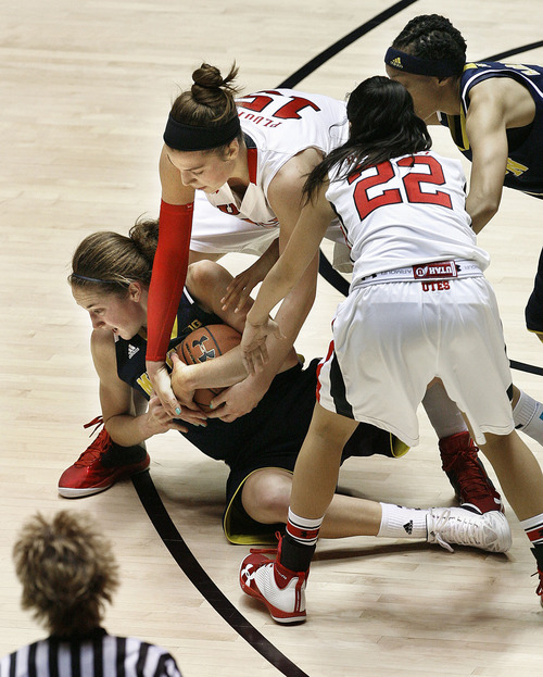 Scott Sommerdorf  |  The Salt Lake Tribune              
Utah's Michelle Plouffe, #15, battles with Michigan's Nicole Elmblad for a loose ball during first half play. Utah beat Michigan 59-40 in women's basketball at the Huntsman Center, Friday, November 16, 2012.