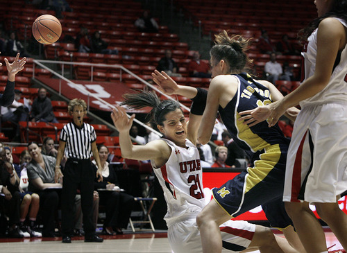 Utah's Chelsea Bridewater takes a charge from Michigan's Kate Thompson during second half play of an NCAA college basketball game at the Huntsman Center in Salt Lake City, Utah, Friday, Nov. 16, 2012. (AP Photo/Scott Sommerdorf, The Salt Lake Tribune)