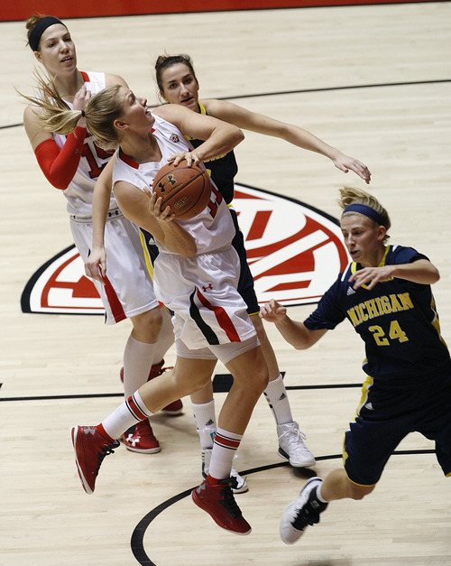 Utah's Taryn Wicijowski goes up for a shot as Michelle Plouffe trails the plays for the Utes during  an NCAA college basketball game at the Huntsman Center in Salt Lake City, Utah, Friday, Nov. 16, 2012. (AP Photo/Scott Sommerdorf, The Salt Lake Tribune)