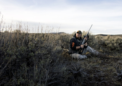 Kim Raff | The Salt Lake Tribune
Hearing conflicting opinions, Ace Redhair considers whether to shoot a buck during an evening hunt in the Diamond Mountain area outside of Vernal on Oct. 30, 2012. Redhair is a wounded Army veteran who was selected for the first-ever Sgt. Daniel D. Gurr Foundation's deer and elk hunt. David Gurr's son, Daniel, died in Afghanistan in August 2011, and he and his wife, Dana, have created a foundation that takes wounded veterans hunting.