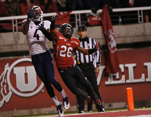 Scott Sommerdorf  |  The Salt Lake Tribune              
Utah Utes defensive back Ryan Lacy (26) was beaten on this play, but Arizona Wildcats wide receiver Trey Griffey (5) could not hold on to this pass in the end zone during second half play. Arizona defeated Utah 34-24 at Rice-Eccles Stadium, Saturday, November 17, 2012.