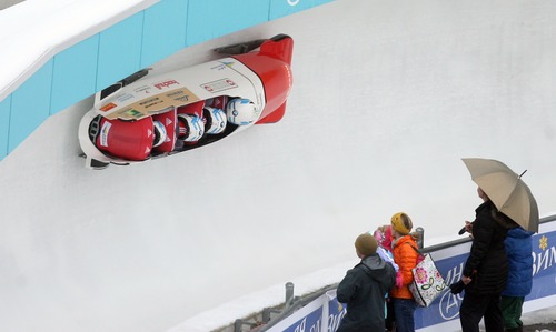 Kim Raff  |  The Salt Lake Tribune
Rico Peter drives Switzerland 1 around curve 6 during heat 1 of the FIBT 4 Man Bobsled World Cup at Utah Olympic Park in Park City, Utah on November 17, 2012. The team went on to place 16th in the event.