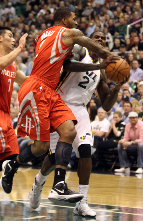 Rick Egan  | The Salt Lake Tribune 

Utah Jazz power forward Marvin Williams (2) is fouled by Houston Rockets point guard Jeremy Lin (7), in NBA action,  Jazz vs. the Houston Rocket's. Monday, November 19, 2012.