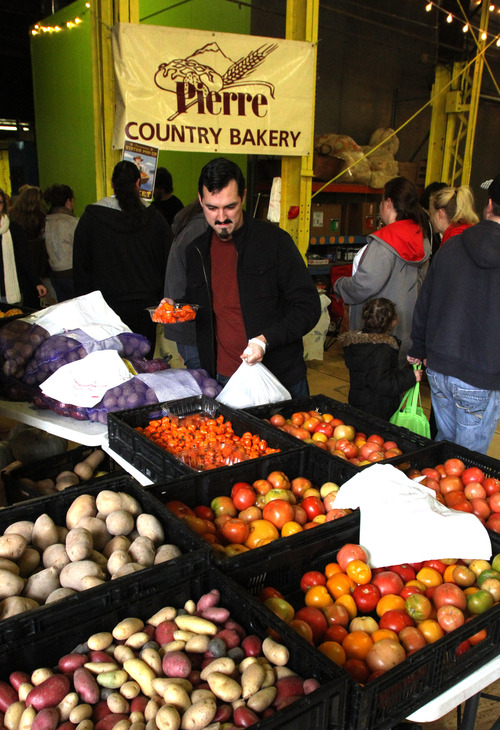 Rick Egan  | The Salt Lake Tribune 
Shoppers check out produce at the downtown "pop up" market (sponsored by the Downtown Alliance) at the Rico Warehouse in Salt Lake City Saturday.