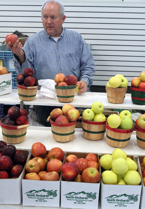 Rick Egan  | The Salt Lake Tribune 
Scott G. Smith, of Smith Orchards in Provo, sells apples at the winter market at the state Fairpark Saturday.