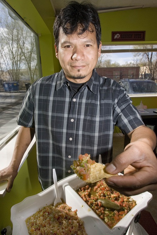 Paul Fraughton | Tribune file photo
Sergio Mendoza loads a chip with one of the  gourmet salsas he makes and sells at Salsa Mendoza in Sandy. Small business advocates are urging Utahns to shop locally this holiday season at businesses like Mendoza's.