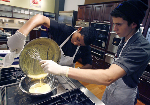 Francisco Kjolseth  |  The Salt Lake Tribune
David Melgar, 14, left, and Francisco Garcia, 17, prepare a roux for gravy as the two teens from the South Salt Lake Police Athletics/Activities League (PAL) prepare Thanksgiving dinner for their families and people in need within their communities. For their fifth year of the event, Norbest donated 24 turkeys that the kids cooked up alongside the South Salt Lake police and fire departments at the Viking Cooking School at Kimball Distributing on Tuesday, November 20, 2012. South Salt Lake PAL programs provide educational, athletic and recreational activities aimed at building self-esteem and trust between police and youth.