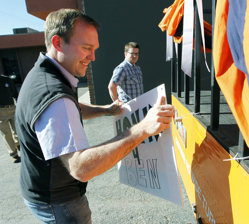 Al Hartmann | The Salt Lake Tribune
Newly elected Salt Lake County Mayor Ben McAdams, left, begins to tear down posters on his campaign bus at his Salt Lake City headquarters with campaign manager Justin Miller Wednesday November 7.