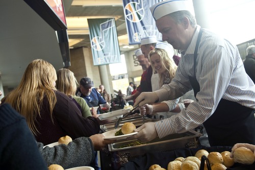 Chris Detrick  |  The Salt Lake Tribune
Utah Jazz President Randy Rigby serves green beans during "We Care – We Share" Thanksgiving dinner at EnergySolutions Arena. The event was sponsored by Salt Lake City Mission, EnergySolutions Arena and Utah Food Services. About 3,500 people were served food by 150 Utah Jazz volunteers.