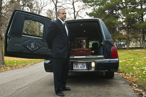 Chris Detrick  |  The Salt Lake Tribune
Spencer Larkin, chief operating officer and vice president of Larkin Mortuary, attends a funeral at Mount Olivet Cemetery Saturday November 17, 2012.