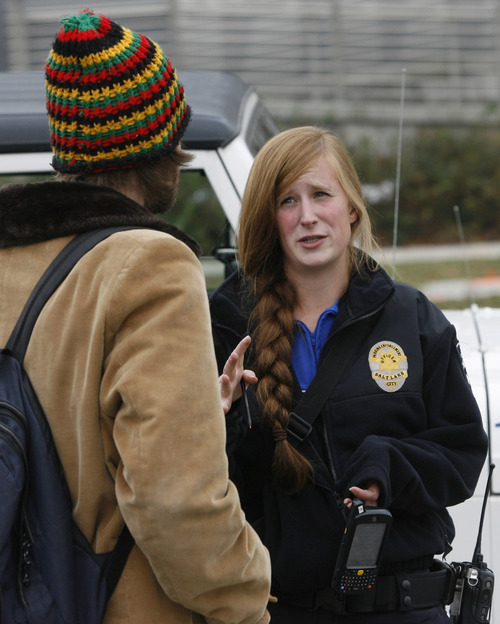 Rick Egan  | The Salt Lake Tribune 

Jen Farrell, parking enforcement officer, talks to Chris Martin, while monitoring the parking spaces in Salt Lake City, Friday, November 16, 2012.